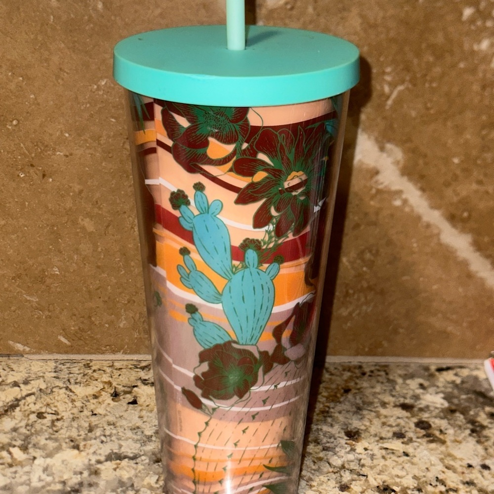 Starbucks Tumbler with lid and straw.